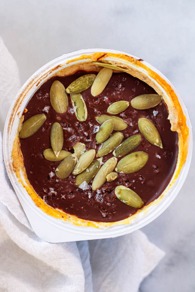 pumpkin spice yogurt bowl with viral magic shell chocolate and pepitas