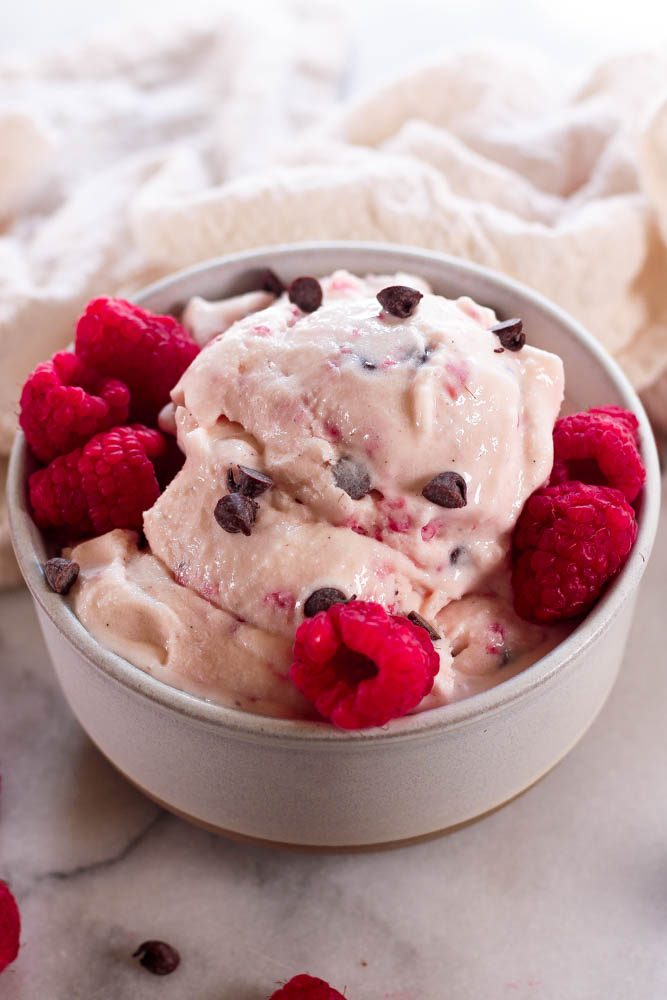 a stone bowl of raspberry chip ice cream made in the ninja creami