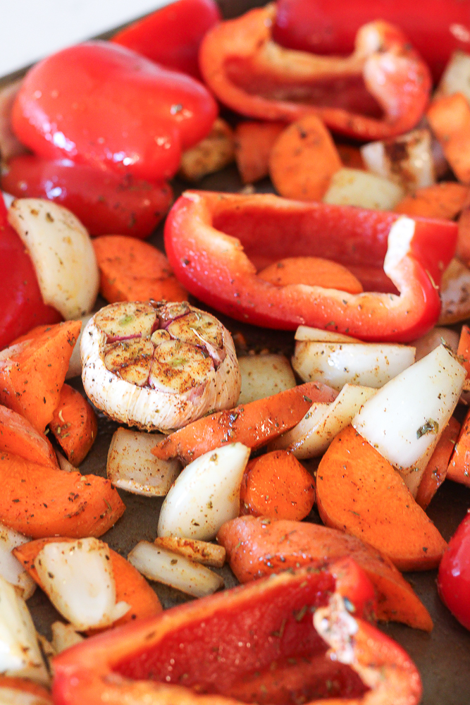 a sheet pan of vegetables to roast for roasted red pepper and gouda soup