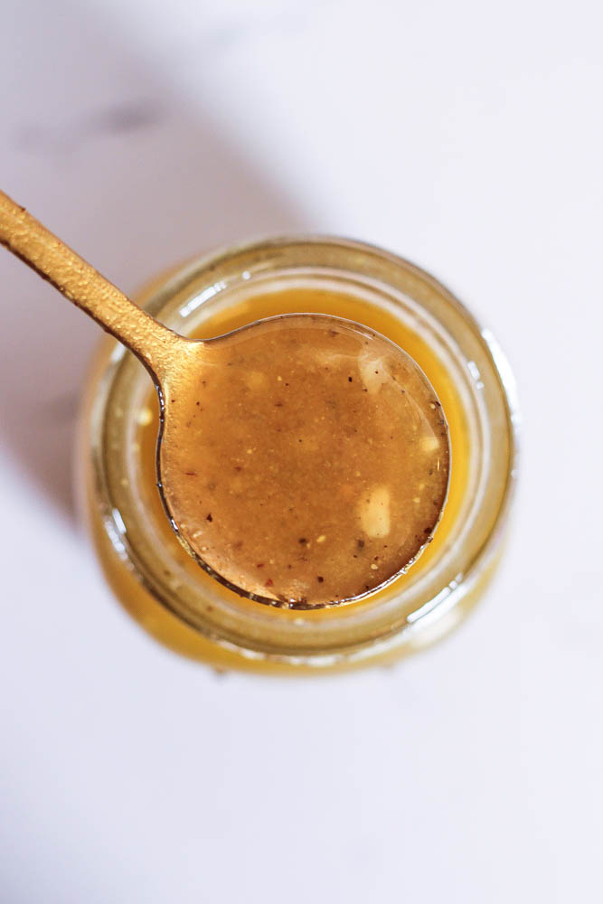 a spoonful of flavorful apple cider vinaigrette