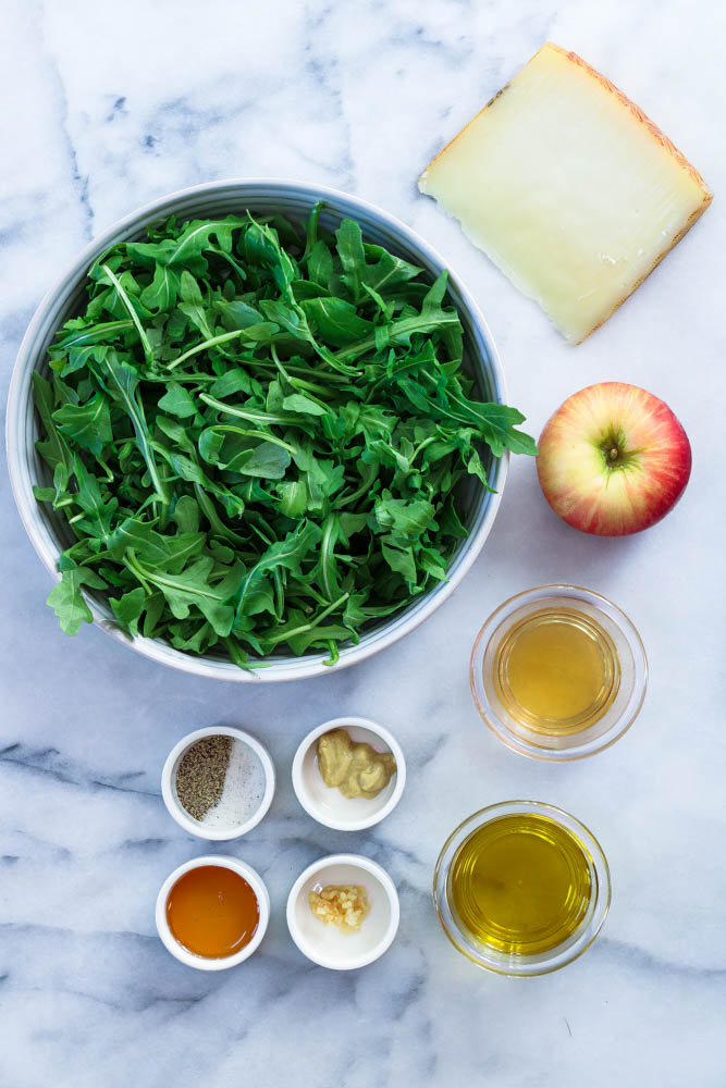 ingredients to make an apple manchego salad with apple cider vinaigrette