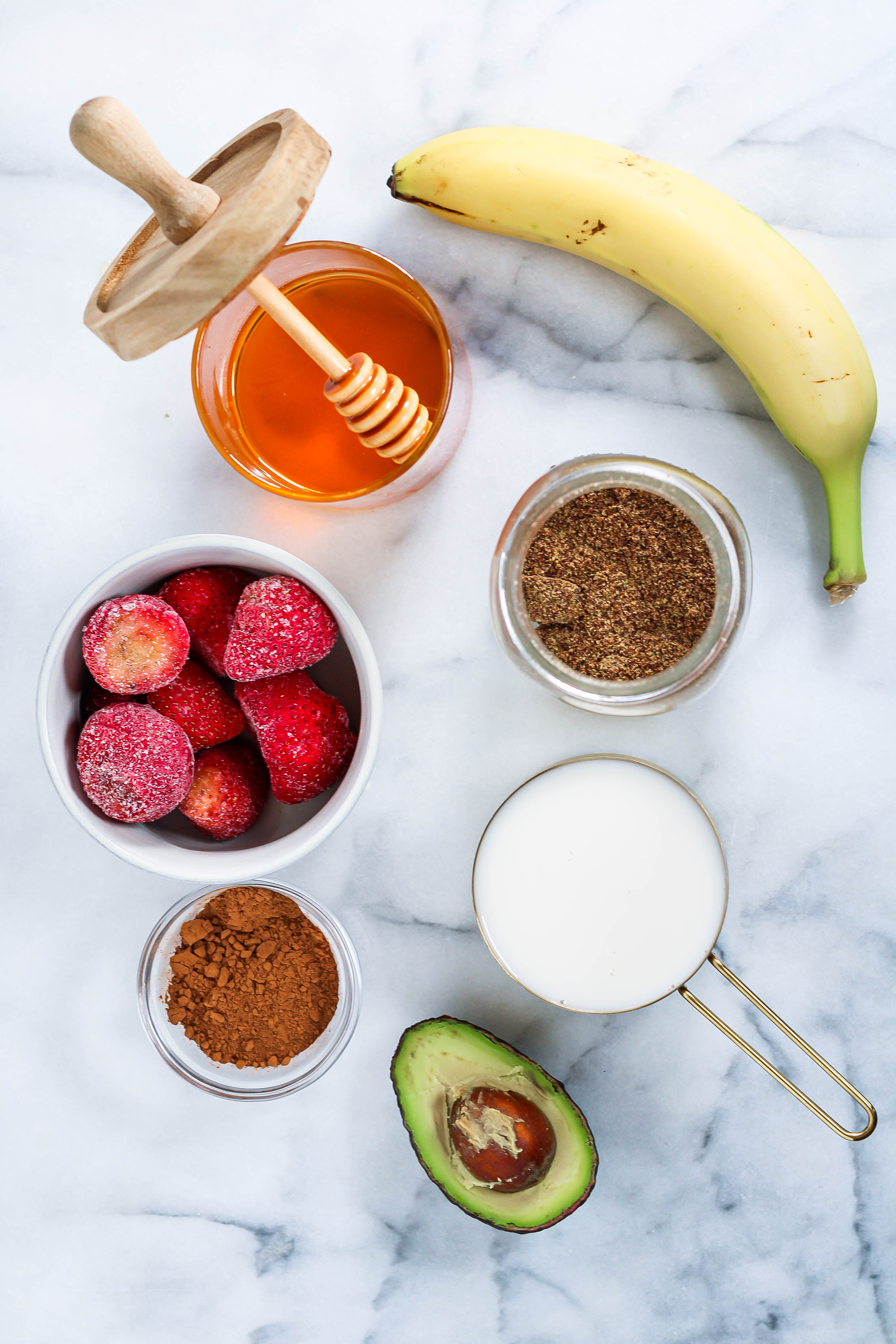 ingredients to make a chocolate strawberry banana smoothie