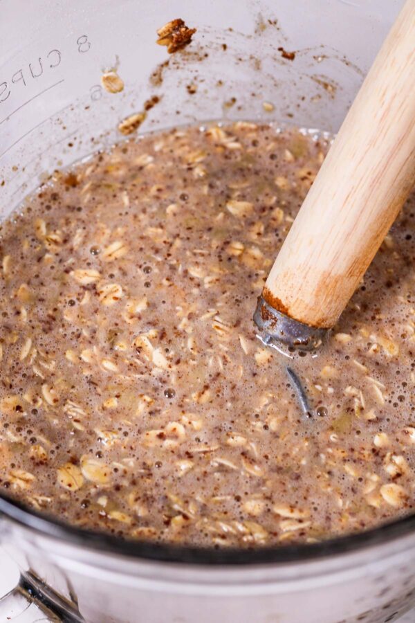 stirring all ingredients for banana bread baked oatmeal