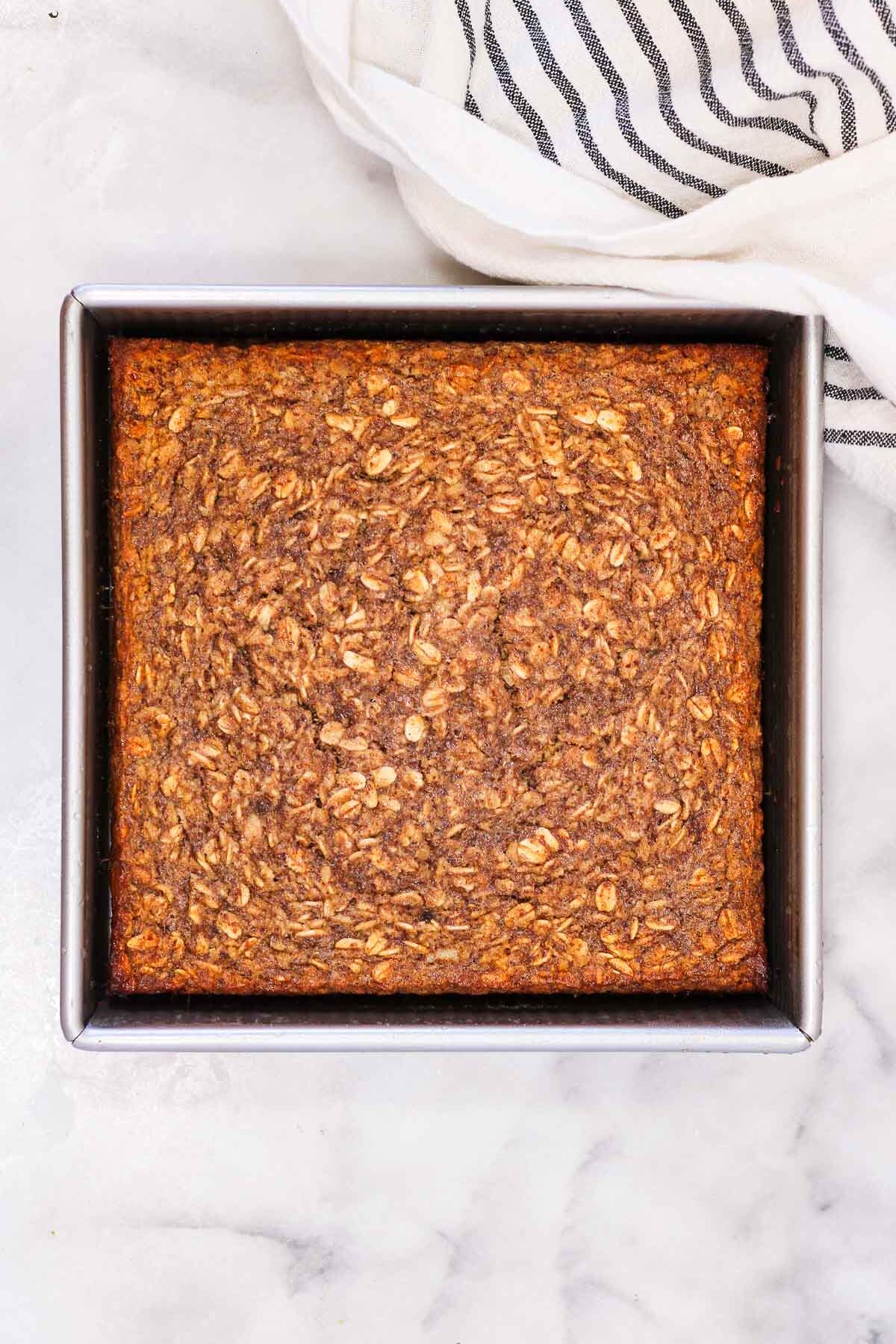 banana bread baked oatmeal in a metal pan