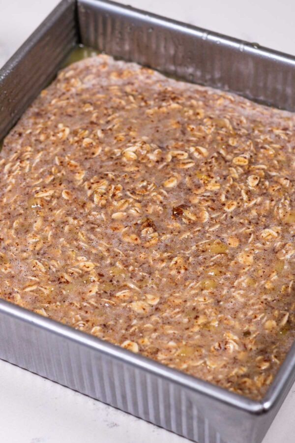 banana bread baked oatmeal poured into a pan