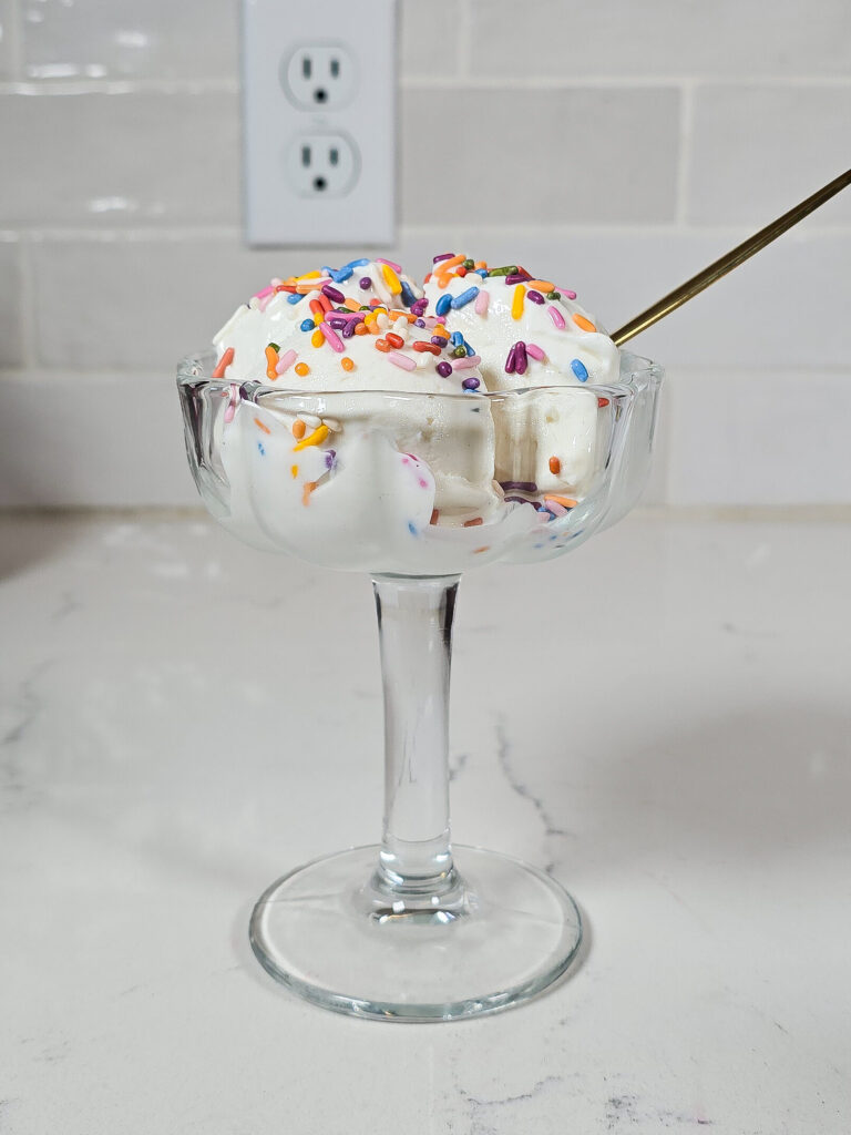 a glass dish of ninja creami frozen yogurt with sprinkles