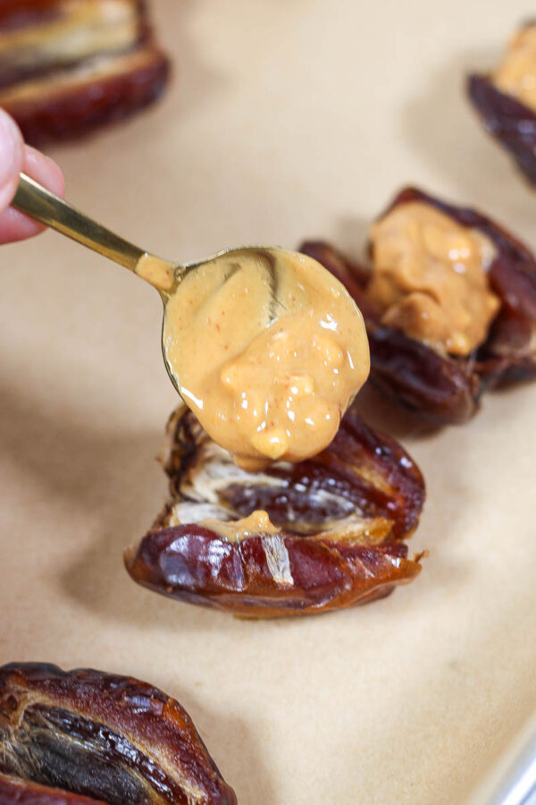 putting crunchy peanut butter into a medjool date