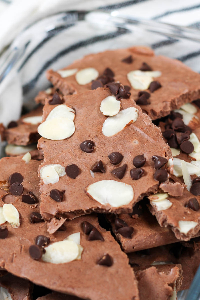 chocolate yogurt bark topped with mini chocolate chips and almond slices