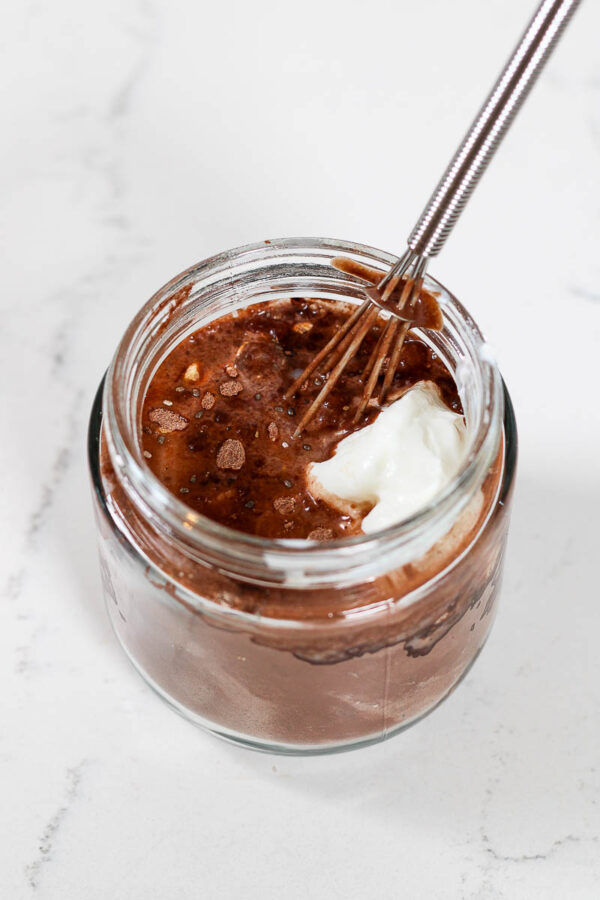 whisking together the ingredients to make cosmic brownie overnight oats