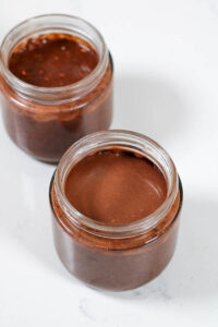adding the "frosting" layer to the cosmic brownie overnight oats