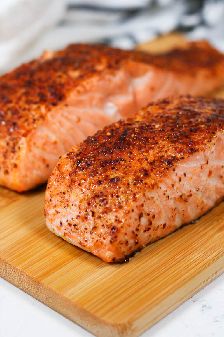 beautiful air fryer salmon fillets on a bamboo board