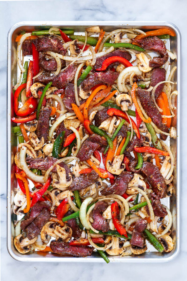 sheet pan of mixed ingredients to make philly cheesesteak bowls