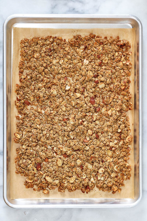 vanilla almond granola on a sheet pan after baking