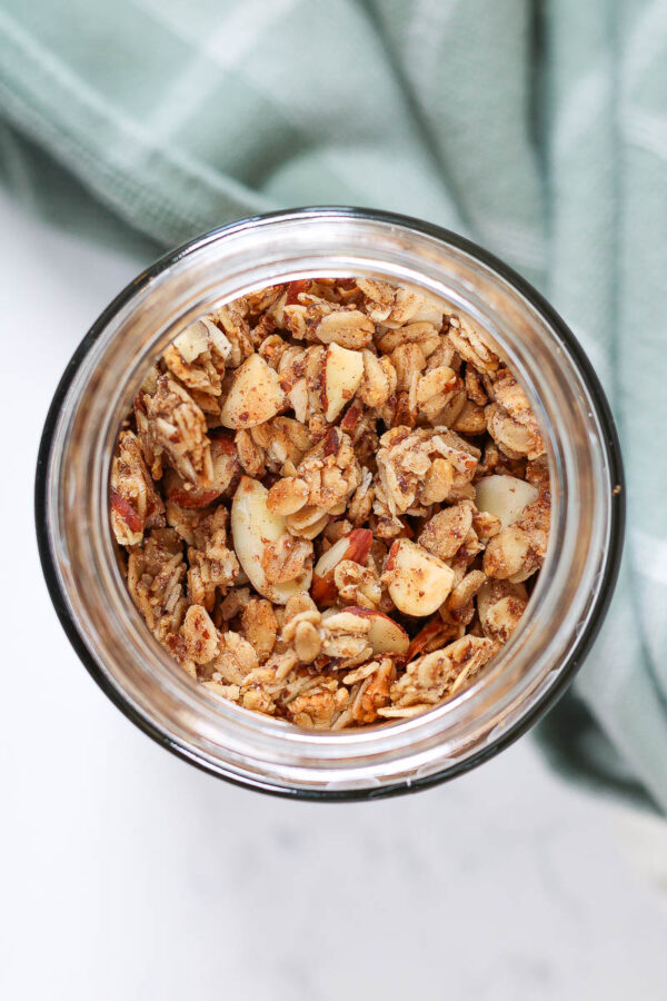 looking down into a jar of vanilla almond granola
