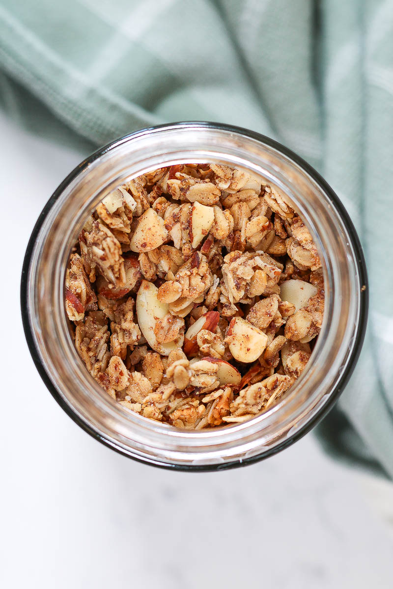 looking down into a jar of vanilla almond granola