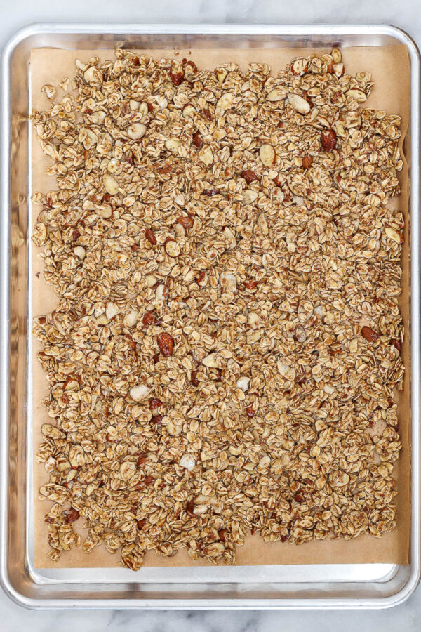 vanilla almond granola on a sheet pan before baking