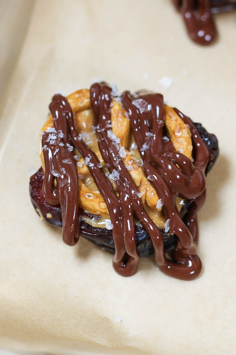 date filled with peanut butter, pretzel, and drizzled with chocolate