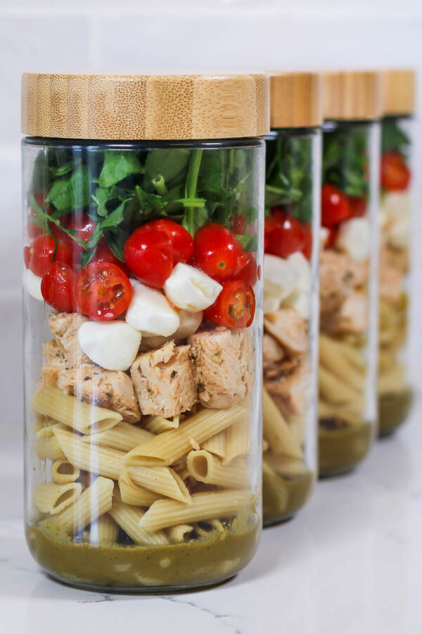 balsamic pasta salad meal prepped in jars with bamboo lids