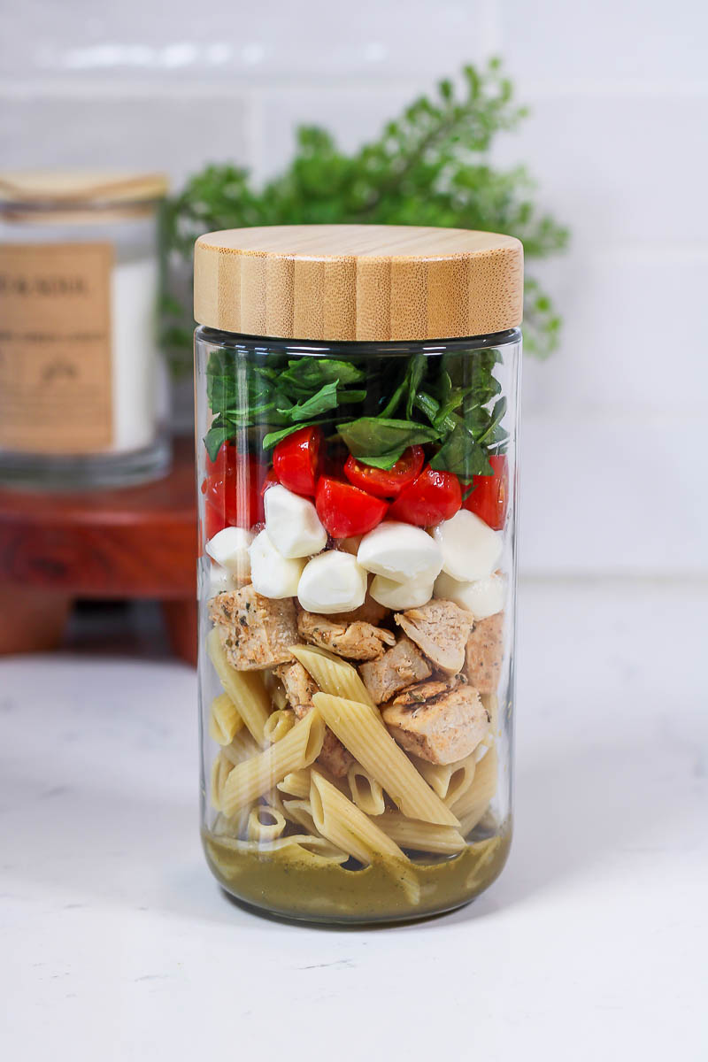 a jar of meal prep balsamic pasta salad