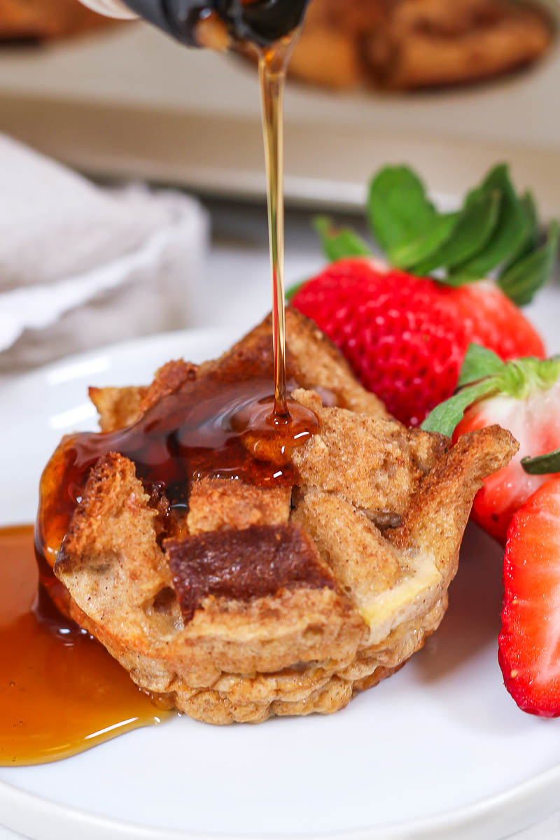 pouring maple syrup on french toast muffins