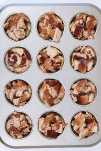 french toast muffins in the muffin pan ready for baking