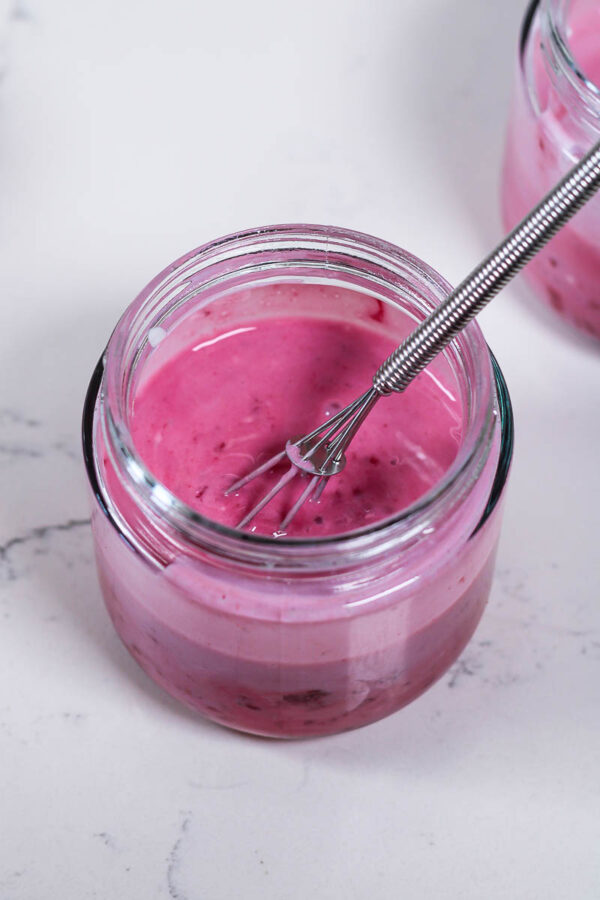 mixing wet ingredients for raspberry overnight oats