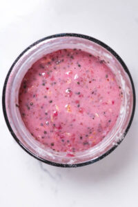 raspberry overnight oats with chia and flax seeds in a glass jar