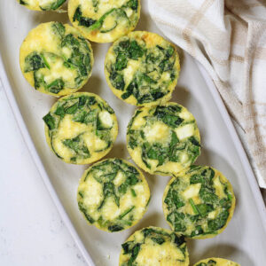 a platter of spinach feta egg bites