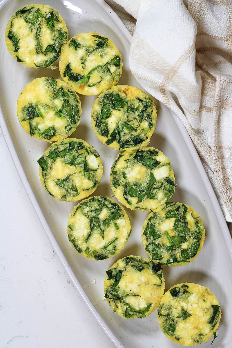 a platter of spinach feta egg bites