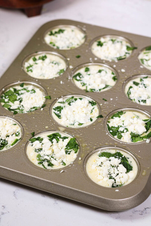 sprinkling feta on for spinach feta egg bites