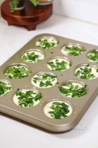 adding spinach for spinach feta egg bites