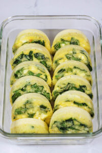 meal prep spinach feta egg bites in a container