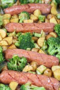 sheet pan honey mustard sausages ready to go in the oven