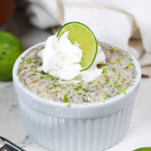 a white ceramic ramekin of key lime pie overnight oats