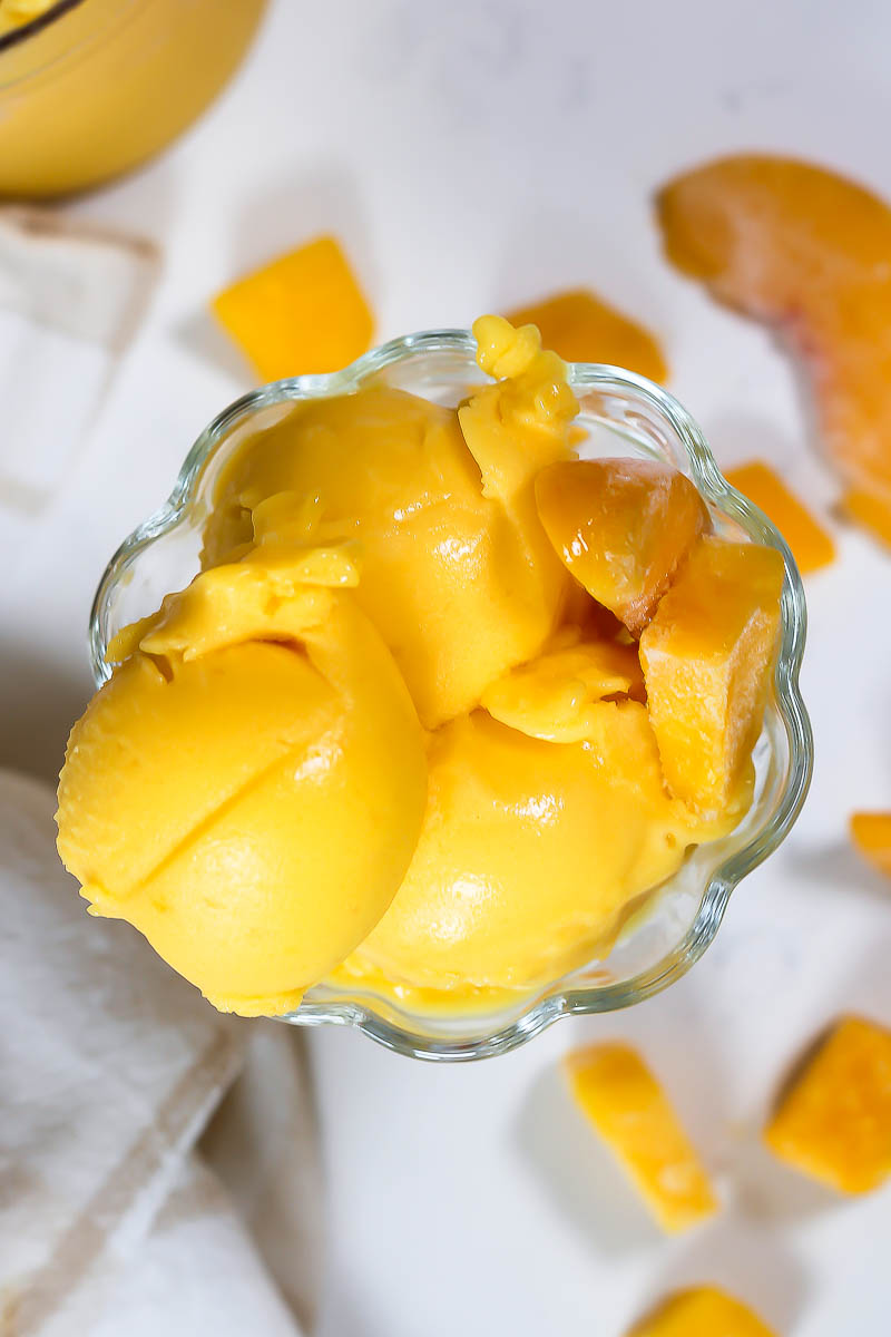 peach mango sorbet in glass dish