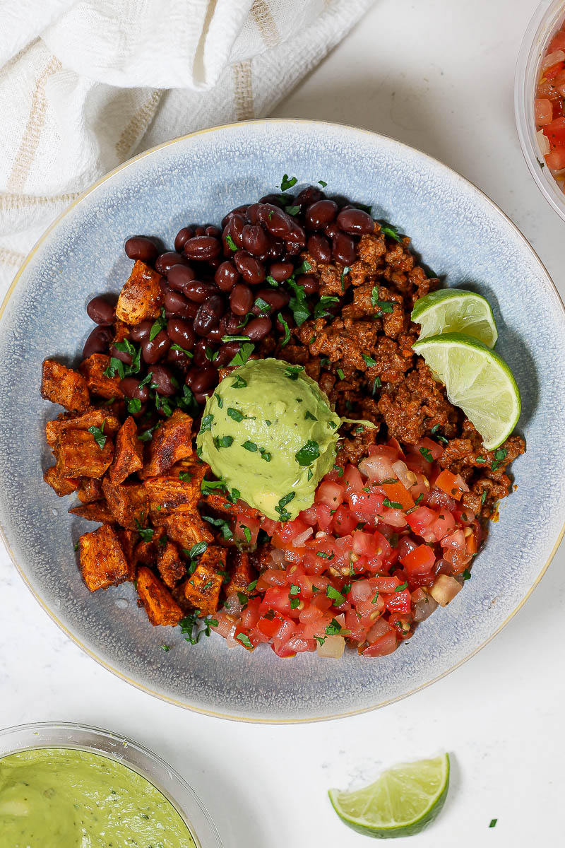 sweet potato taco bowl in a blue shallow bowl