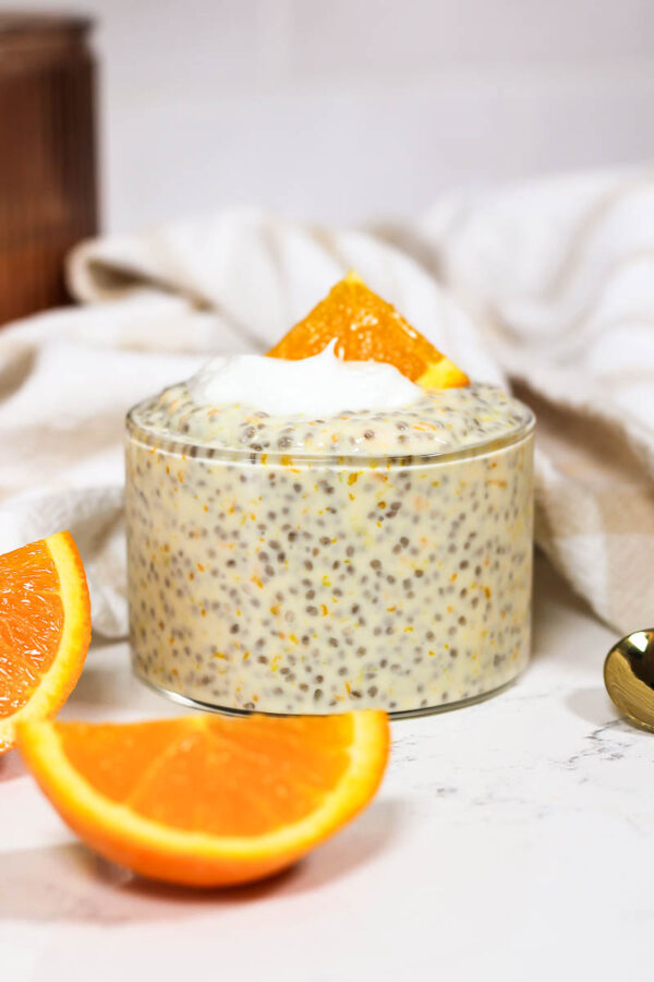 a glass cup of creamsicle orange chia pudding