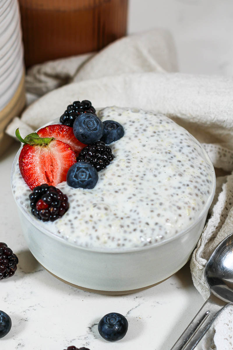 a bowl of quinoa chia pudding topped with berries