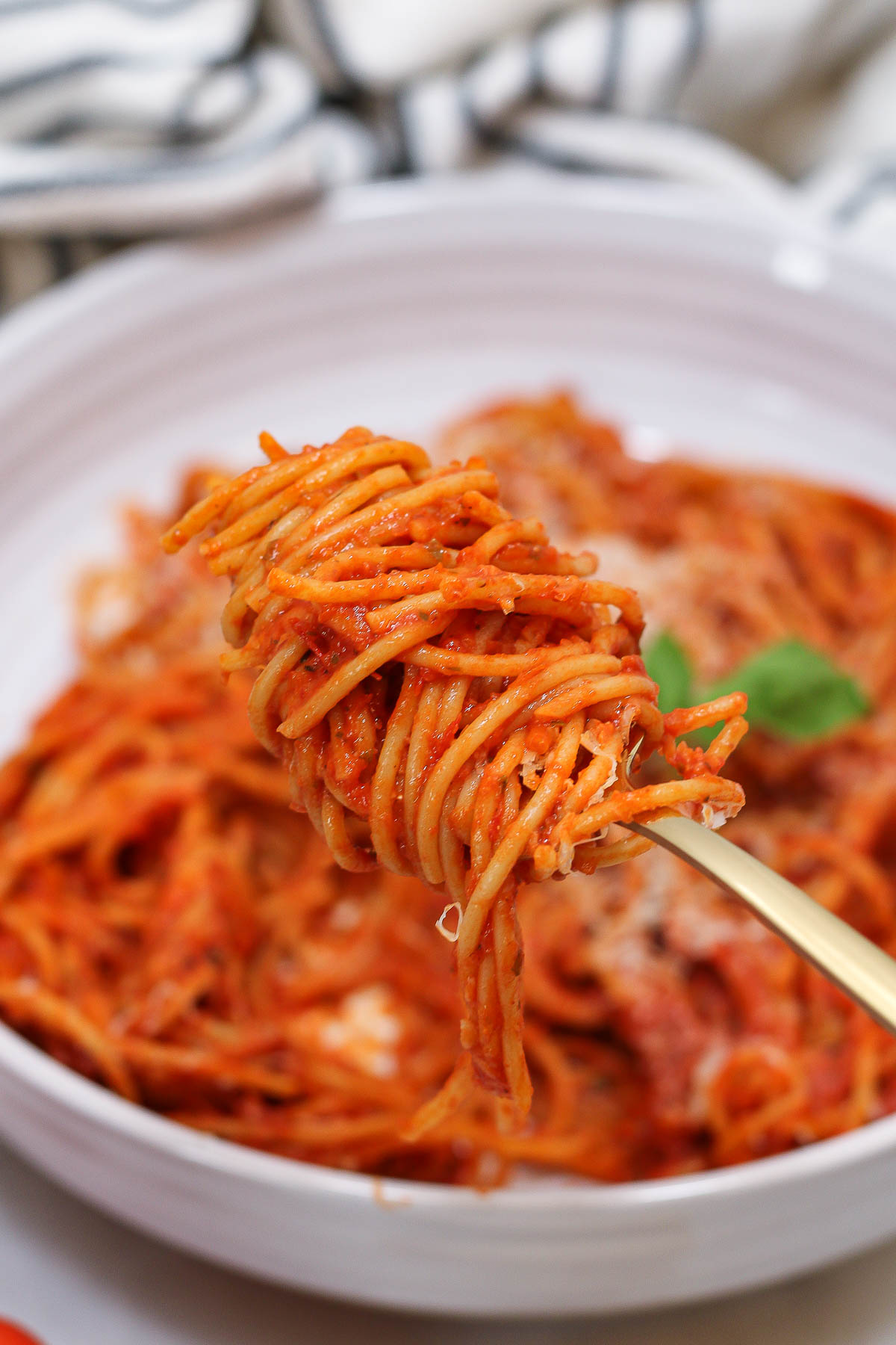 a forkful of roasted tomato pasta sauce spaghetti