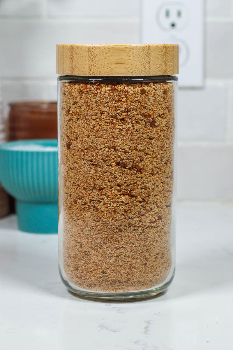 homemade whole wheat bread crumbs in a glass jar with bamboo lid