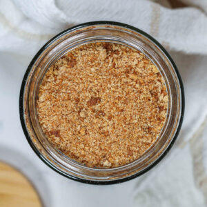 a glass jar of homemade whole wheat bread crumbs
