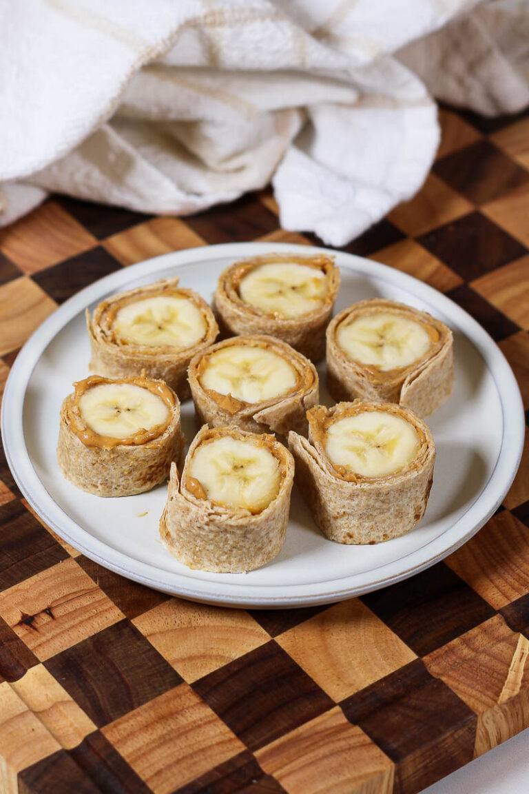 a plate of banana sushi