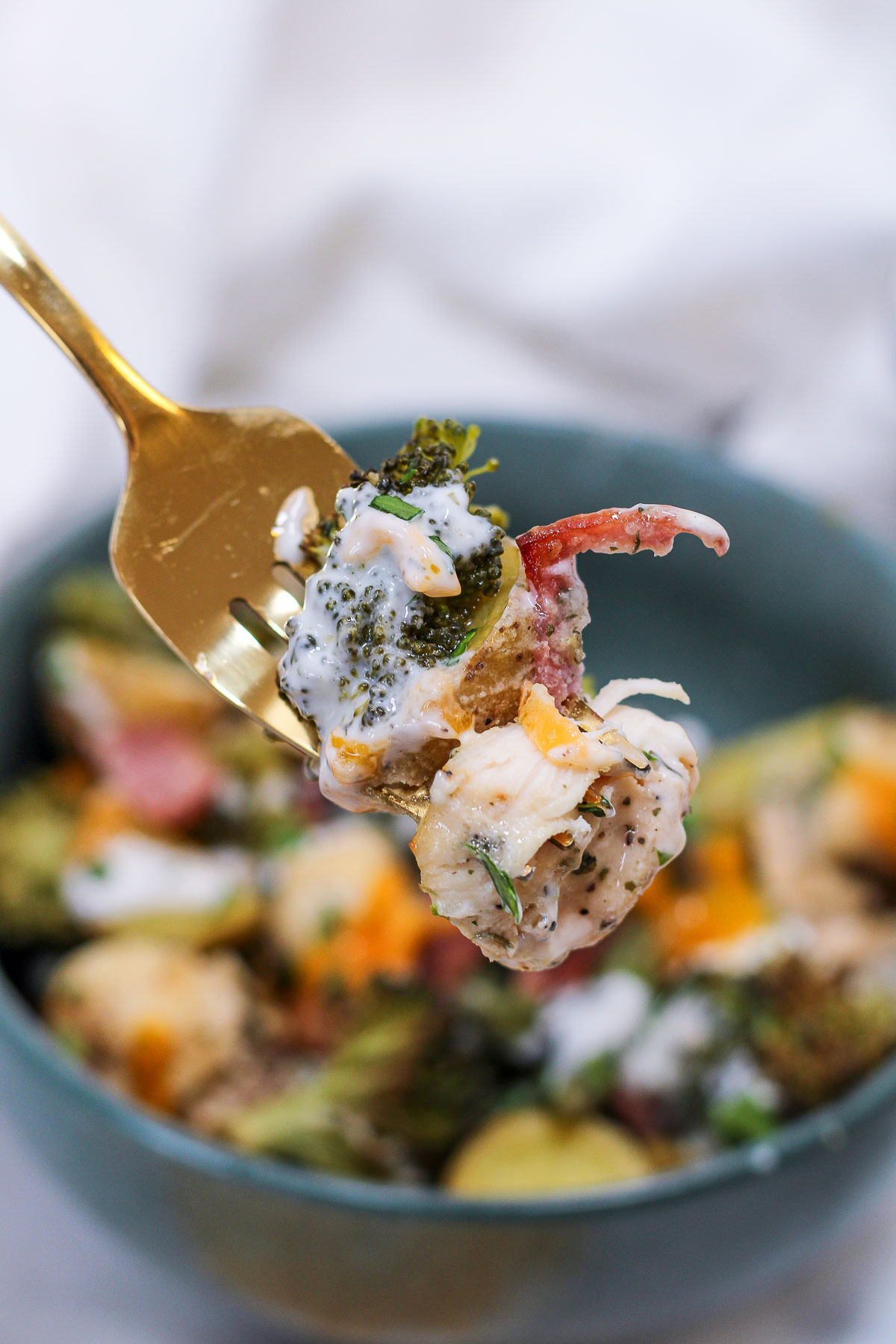 a forkful of food from the chicken bacon ranch bowl