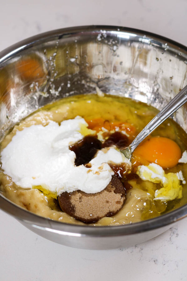 wet ingredients in a bowl to make greek yogurt banana muffins