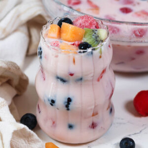 a glass of hwachae with fruit