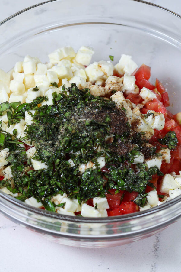 caprese salad dip ingredients in a bowl
