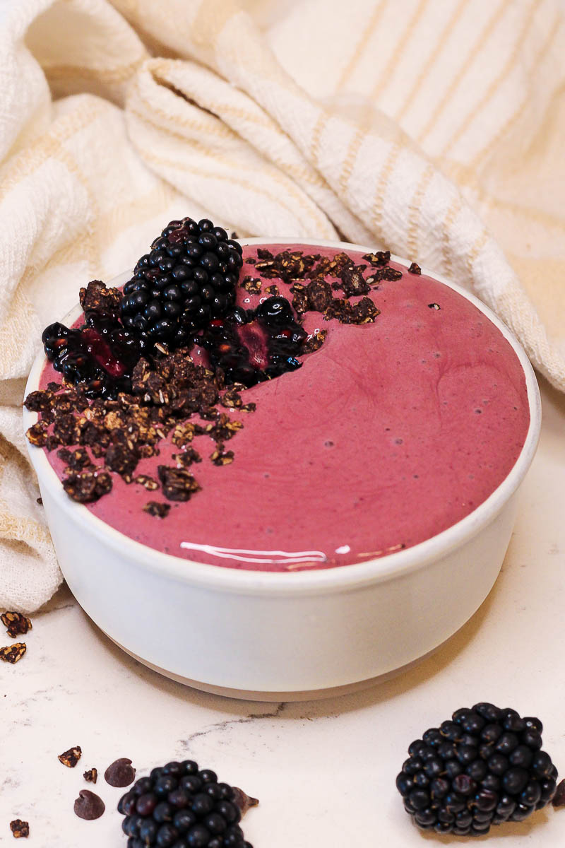 a pretty pinky purple chocolate blackberry smoothie as a smoothie bowl