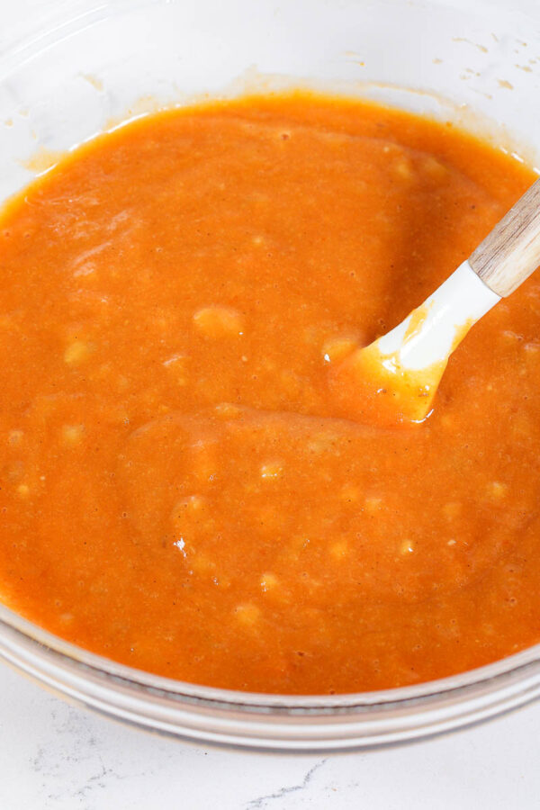 mixing wet ingredients together for pumpkin banana bread muffins