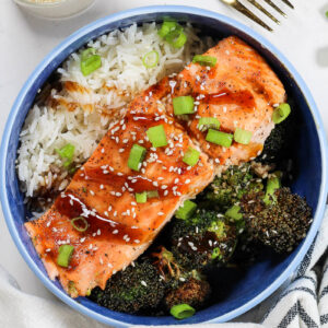 teriyaki salmon bowls in a blue bowl