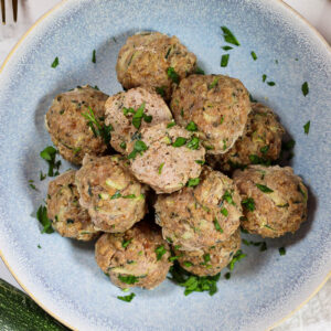 zucchini turkey meatballs in a blue bowl
